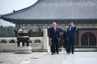 China's President Xi Jinping (R) and US President Donald Trump visit the Temple of Heaven